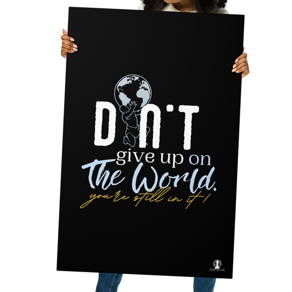 Woman holding the Don’t Give Up 24×36 metal print by Nopaune in front of her body, showcasing its size, sleek finish, and bold typography.
