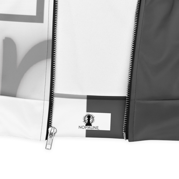 Close-up of the Dual Jacket by Nopaune showing bottom hem, inner edge, and stitching detail.
