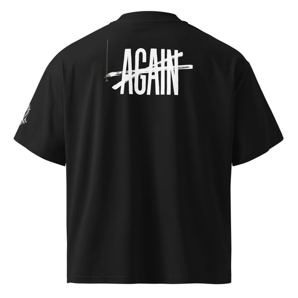 Black t-shirt against a white background, displaying word "AGAIN" (crossed-out) on the back side. 