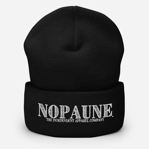 A black, cuffed beanie displaying the words "Nopaune. The Independent Apparel Company" in white embroidery.