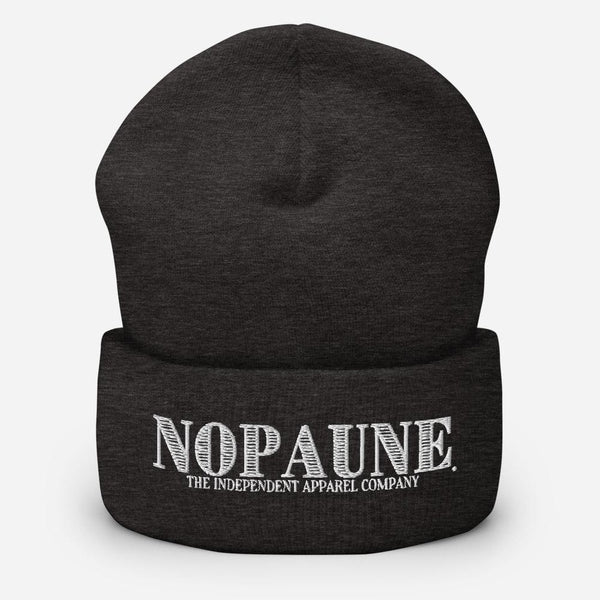A dark-gray, cuffed beanie displaying the words "Nopaune. The Independent Apparel Company" in white embroidery.