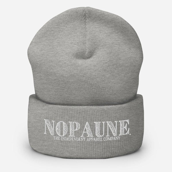 A light-gray, cuffed beanie displaying the words "Nopaune. The Independent Apparel Company" in white embroidery.